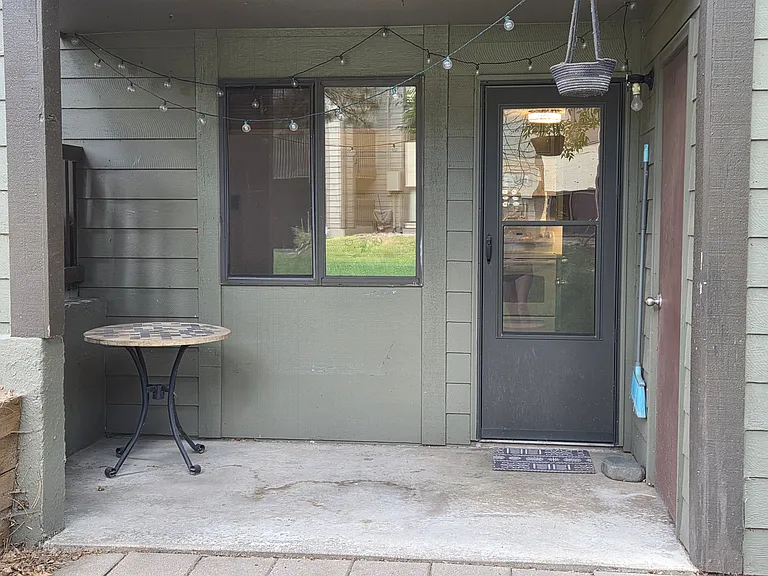 Rear patio backing to open, green space