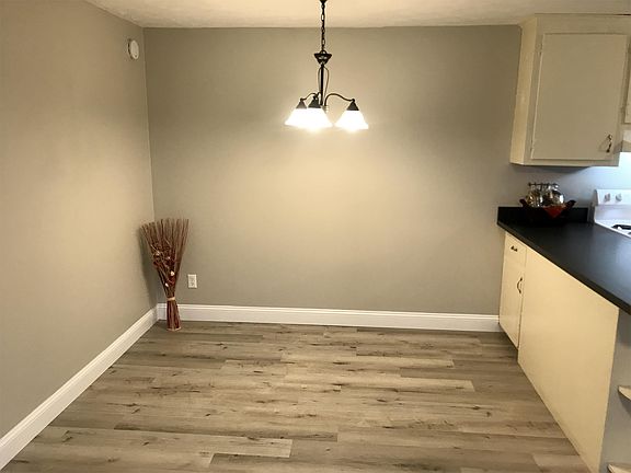 Dining area w/ chandelier for kitchen table