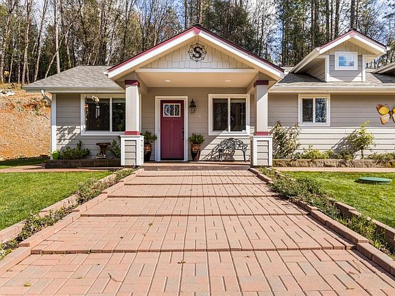 Covered front porch and dormers add to the appeal