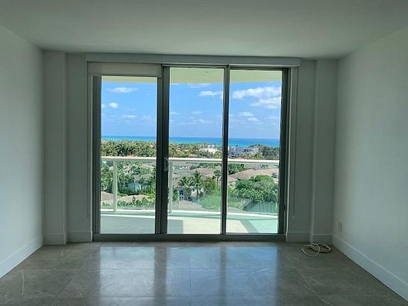 View from Living Room and Balcony over Lush Golden Beach towards Ocean