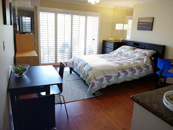 Compact studio with necessary amenities.