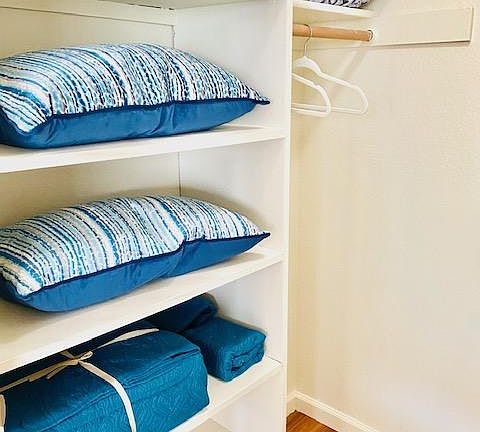 Studio Walk In Closet With Built In Shelving Left Side View