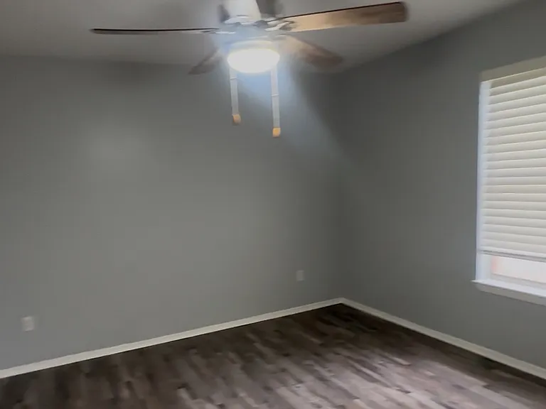 Bedroom with ceiling fan is large enough for a king size bed