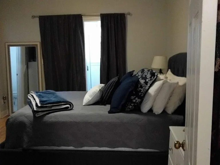 One of two bedrooms shown with furniture (large room)
