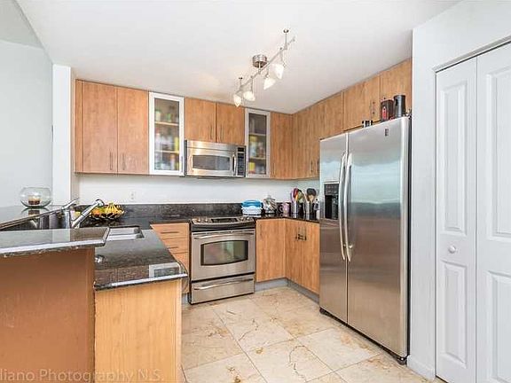 3rd image of 7900 Harbor Island Dr #Townhome
