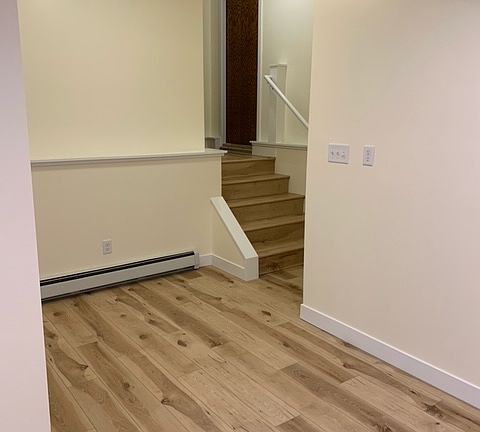 Entry with door outside and door to the garage