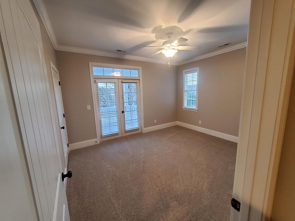 Front upstairs bedroom has its own deck.