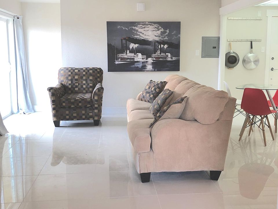 The Pat: 1BD / 1BA. Great room. Walk-out balcony. Shown with transitional decor.