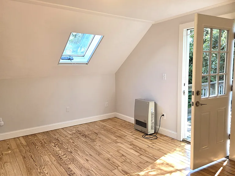 bedroom with access to a large deck