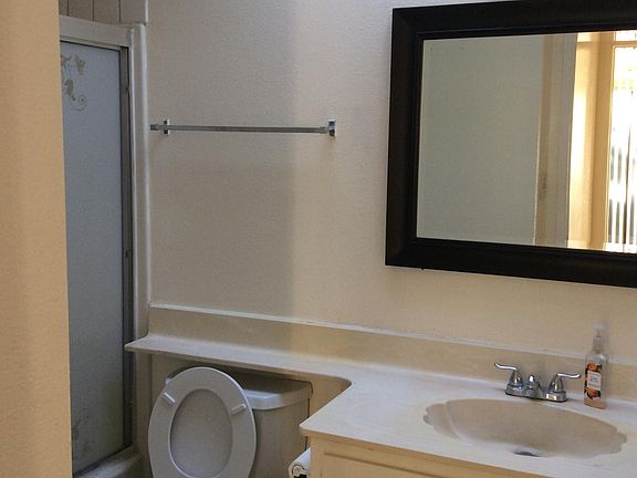 Bathroom with skylight and heated fan