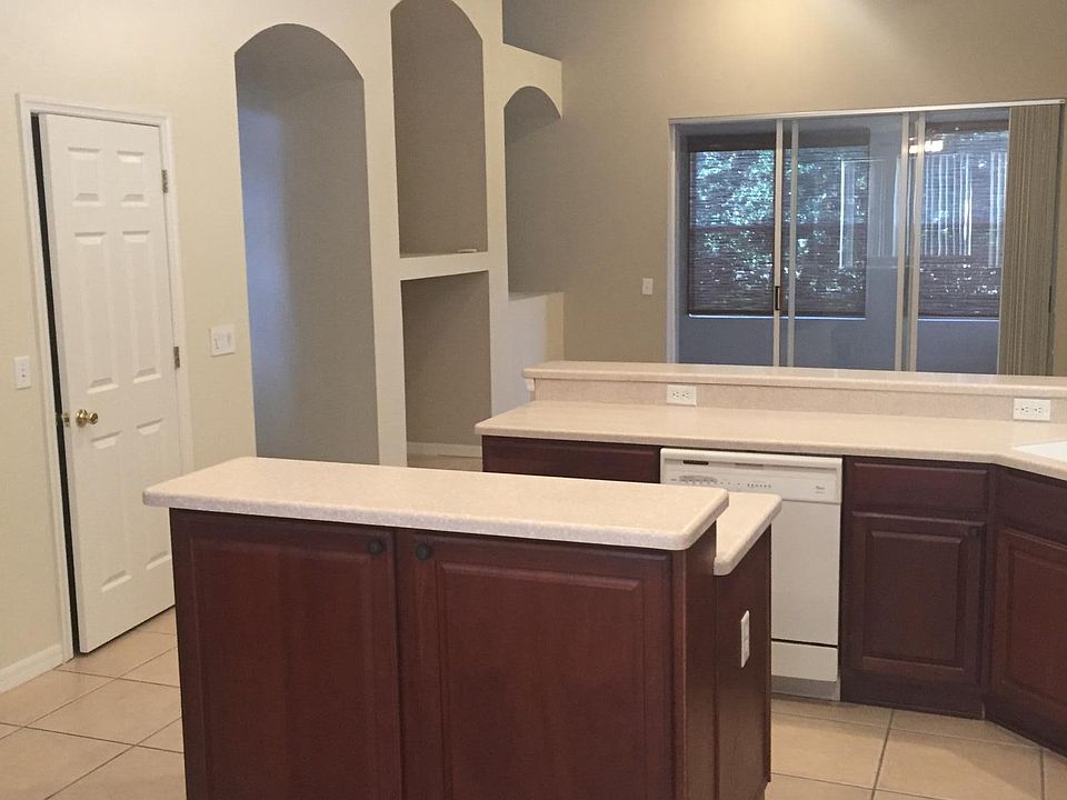 Kitchen looking to family room and enclosed porch
