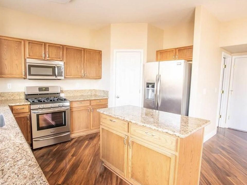 Spacious kitchen with pantry. Entry from garage into kitchen with half bath upon entry from garage.
