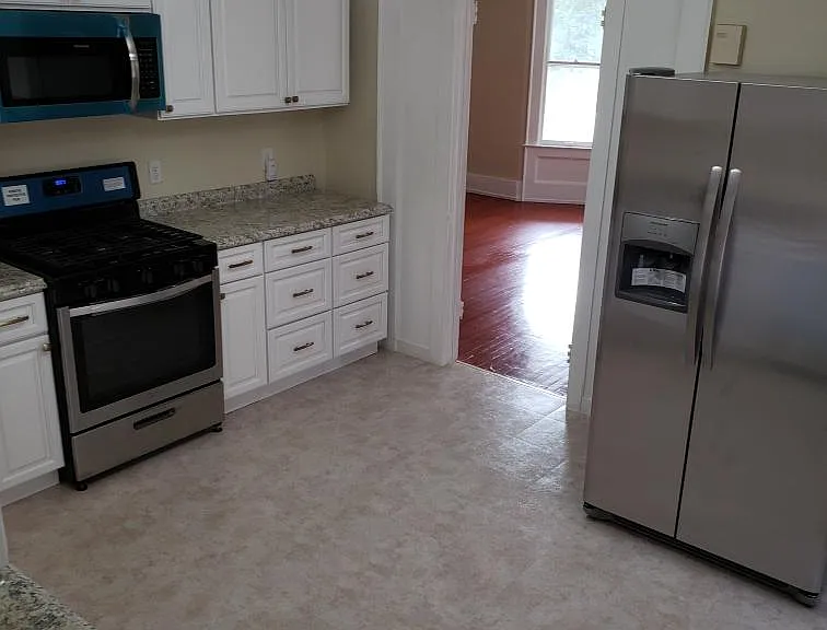 Plenty of cabinets, drawers, counter space, and room for a table and chairs