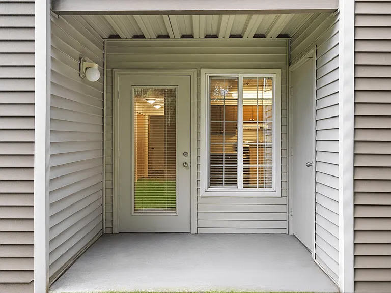 Relax on your own private patio with added storage.