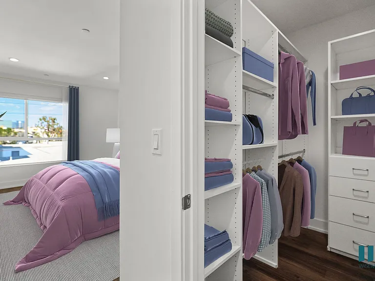 Bedroom with Vinyl Flooring, Recessed Lighting, and Walk-In Closet with Built-In Organizers