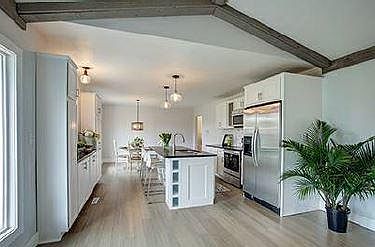 Open concept Kitchen with granite countertops & stainless steel appliances
