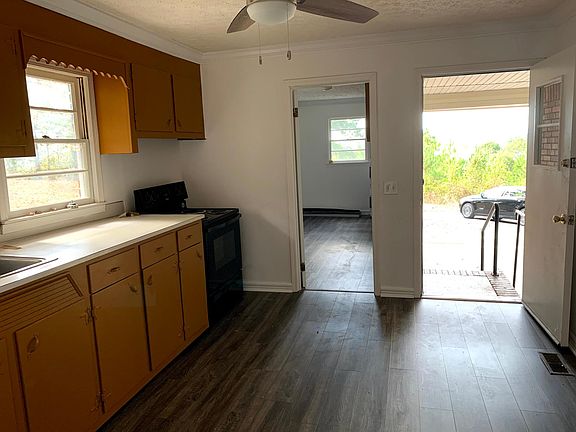 View from Kitchen of Extra Room & Covered Garage