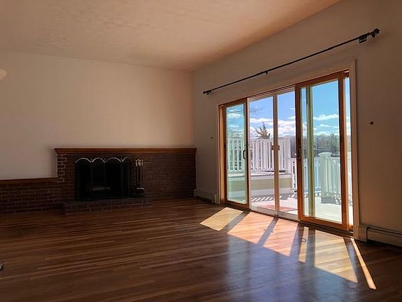 Large Living Room / Dining Room. Hardwood floors, fireplace, sliders to large deck. Fantastic views.