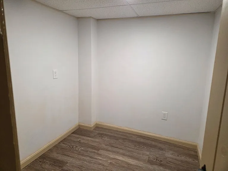 Small bonus room off the kitchen that could be used as an office, pantry, playroom, or for extra storage.