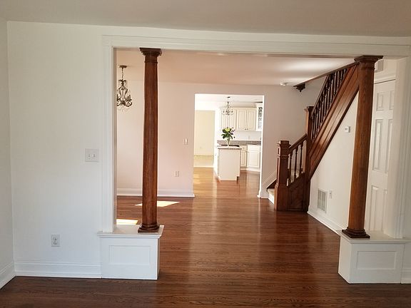 view from living room through dining room, kitchen and family room