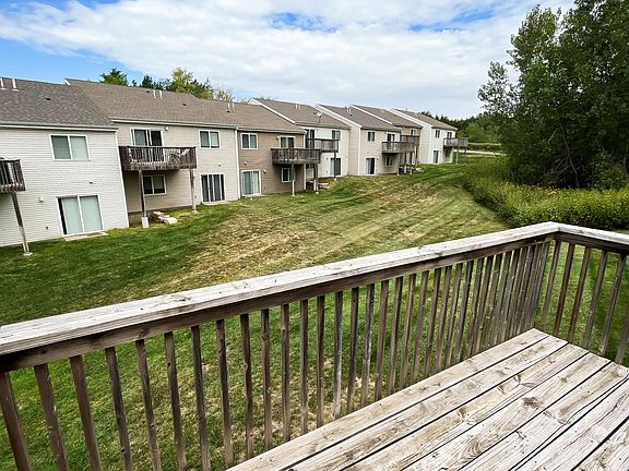 Back yard view from the deck/balcony. Lots of space for kids to run around! There is a walkout sliding door in the basement from Bedroom #2 for direct access to the back yard area.