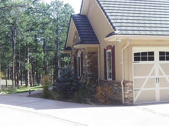 concrete circular drive to 3 bay garage