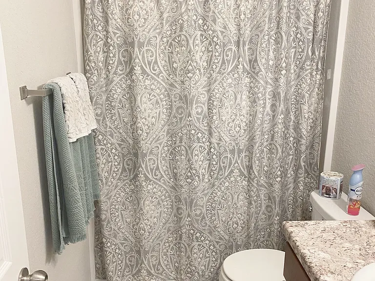 Hall bath has shower/tub combination.