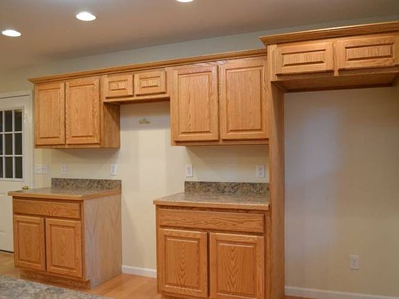 Another look at the custom oak cabinetry. The door to the left of the image is access to the attached 2 car garage; a short walk after a trip to the grocery store.