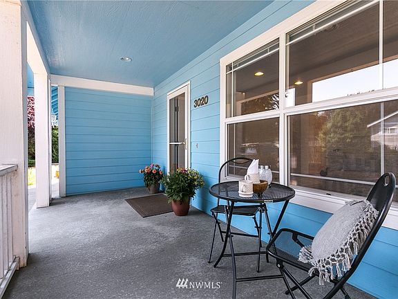 Covered front patio... Great place to sit & relax.