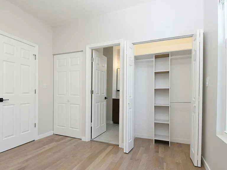 Two primary bedroom closets