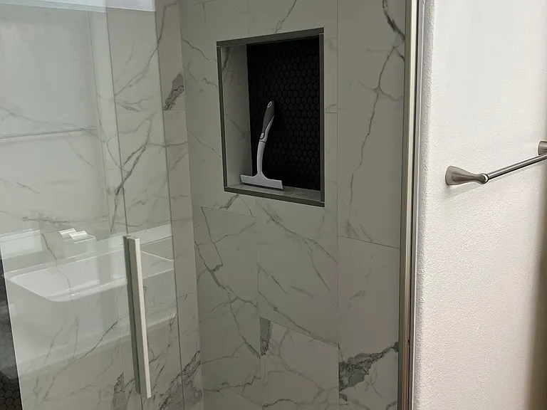 Primary bathroom walk in shower with cubie pictured.