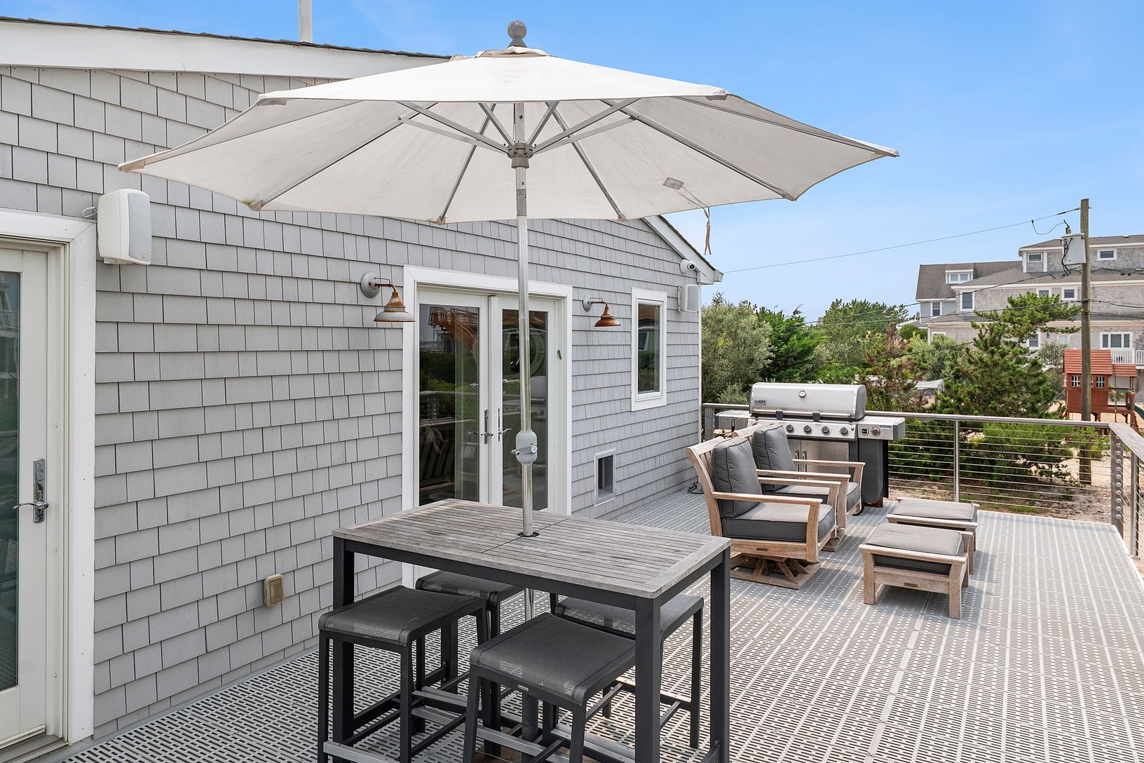 Deck featuring outdoor dining area and area for barbeque.