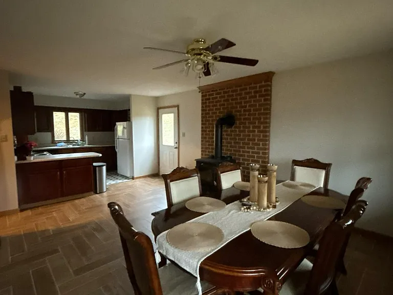 Dining room and kitchen, with kitchen attached to the entry room