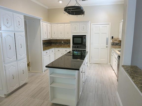Updated kitchen with dramatic island and ample storage! The