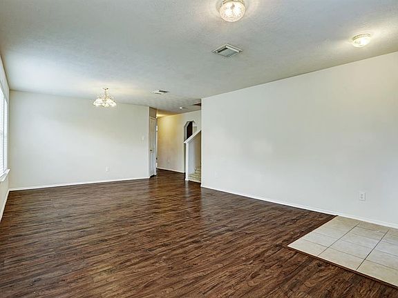 This view shows the Formal Living/Dining combination with the laminate wood floors.