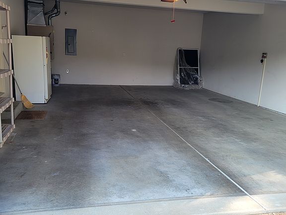 2.5 car garage with freezer, storage and attic access