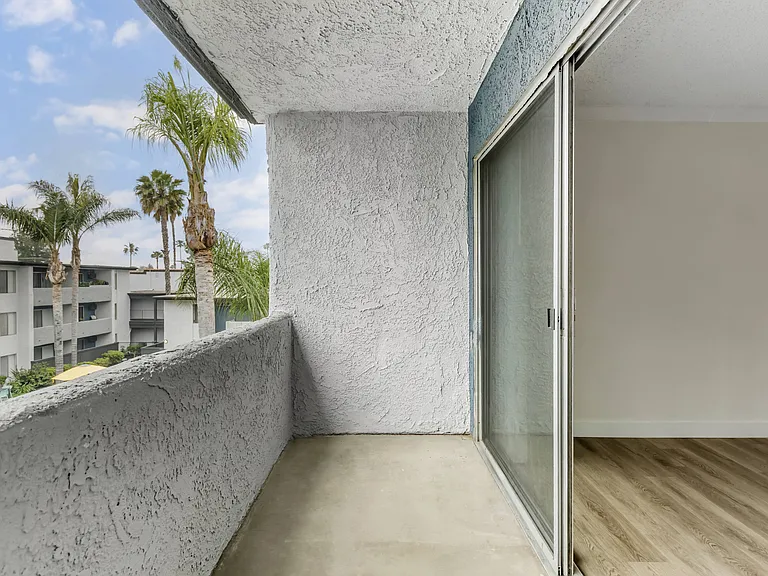 Step into serenity with our Cornerstone Apartments - where every balcony offers a gateway to tranquil palm-lined patios, perfect for embracing the outdoors right at home.