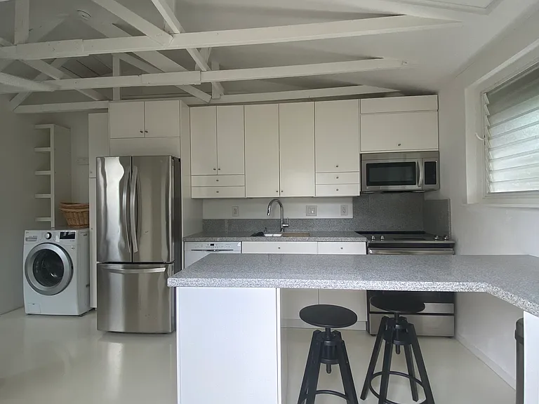 Eat in kitchen with full size appliances including dishwasher and garbage disposal. Fully stocked kitchen and dining implements.