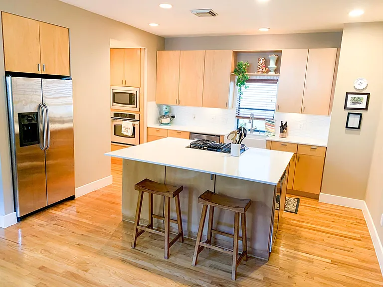 Remodeled kitchen with new countertops and backsplash