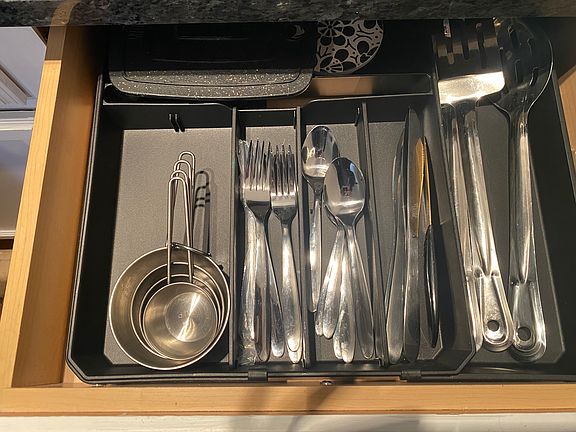 Kitchen includes all the essentials: silverware, microwave, and mini Keurig,