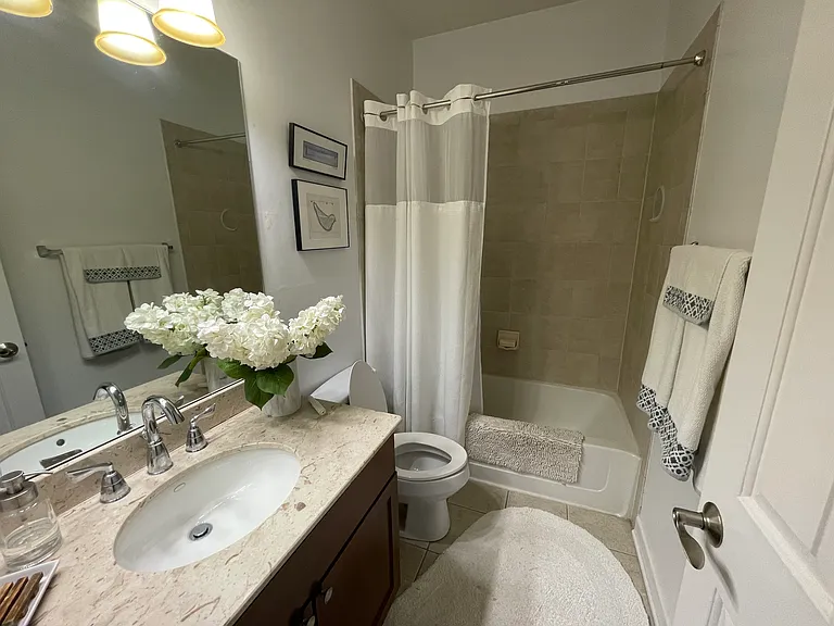 Upstairs full bath shared between bedrooms 2 and 3