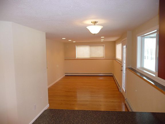 Looking towards living room from kitchen. Back door on the right.