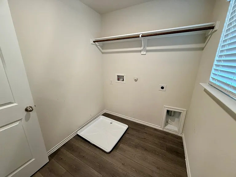 Utility room with washer and dryer hookups