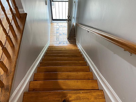 hardwood staircase to first floor