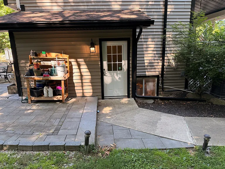 Side door/main entrance of the home for tenant.