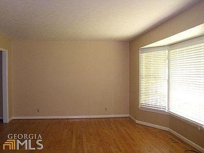 Living room and bay window looking out at front yard