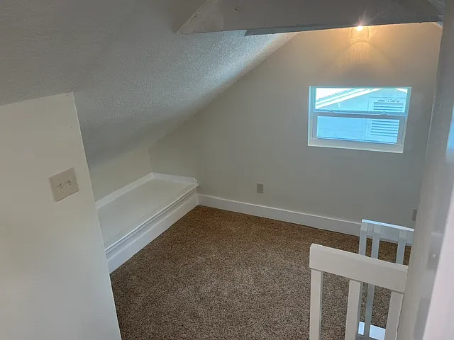 Upstairs landing big enough for a love seat or smaller couch.