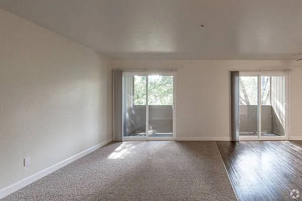 Living/dining room with private balcony.