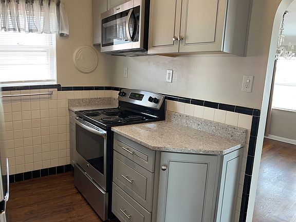 New Kitchen, Granite, Stainless, Dishwasher, Microwave, Range, Disposal, Fridge, Five electric outlets, under cabinet lighting, lots of cabinets and pantry closet