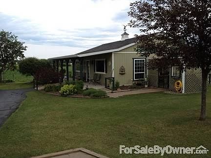 Angle view of 28x34 ft finished Shop
						:
						Attached heated Green house on back